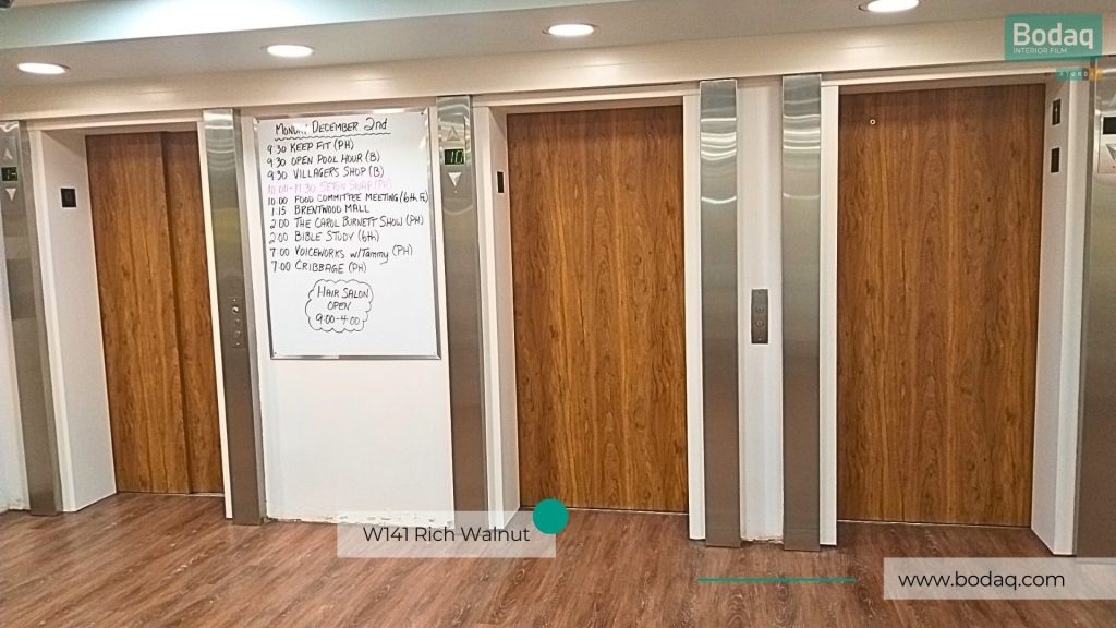 Elevators Doors Wrapped with W141 Rich Walnut