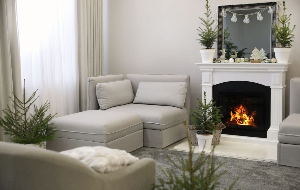 Seasonal decoration, like pines during winter, are perfect for the fireplace.