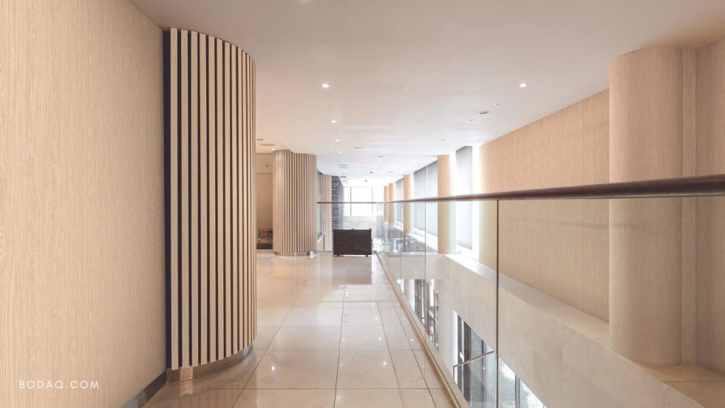 Bright beautiful hallway with wall panels wrapped with Bodaq interior film